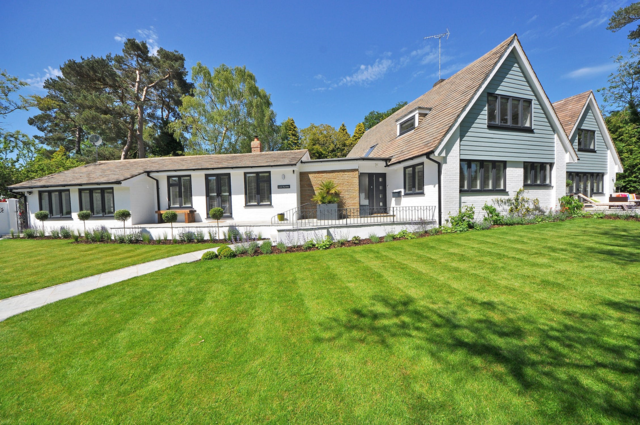 Beautiful home with lush artificial grass lawn and putting green in Arizona.
