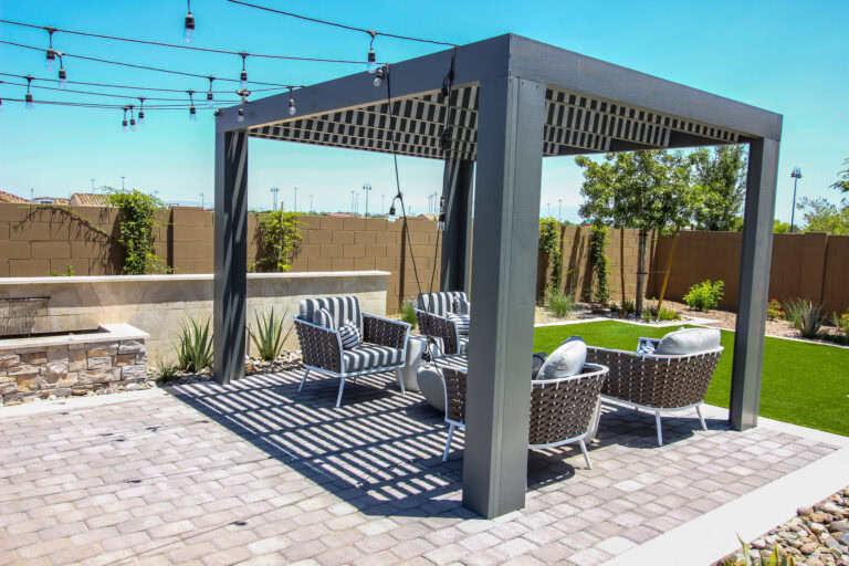 Elegant outdoor patio with luxury turf and seating area in Arizona.