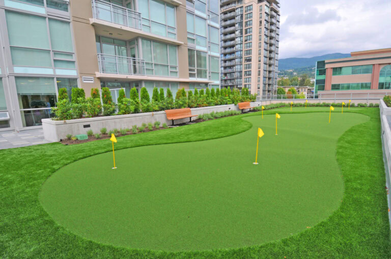 High-quality synthetic putting green turf in an urban outdoor setting.