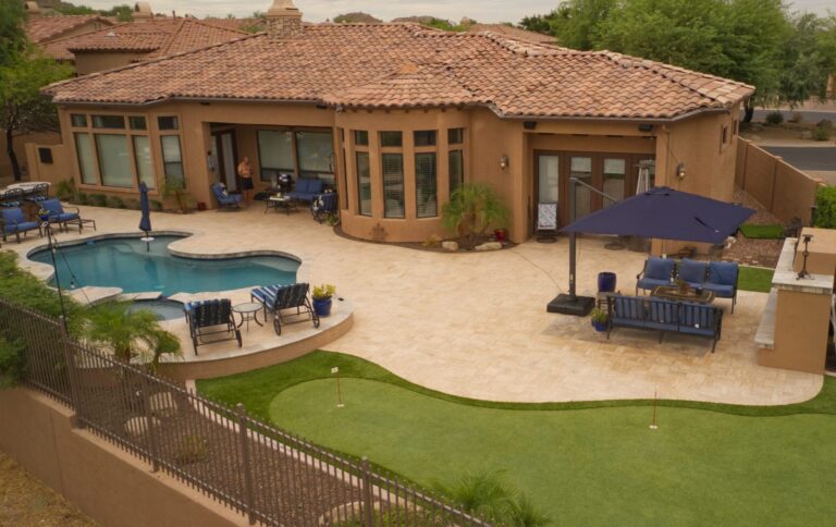 Arizona backyard with artificial grass and putting green for golf practice.
