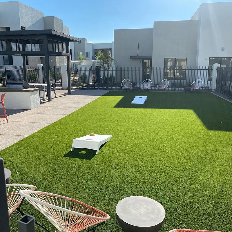 Artificial turf putting green in modern outdoor space in Arizona.