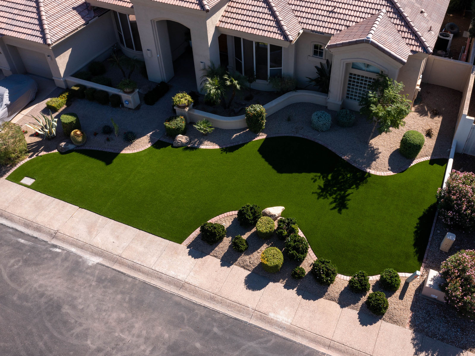 Aerial view of artificial turf and hardscaping installed in Arizona