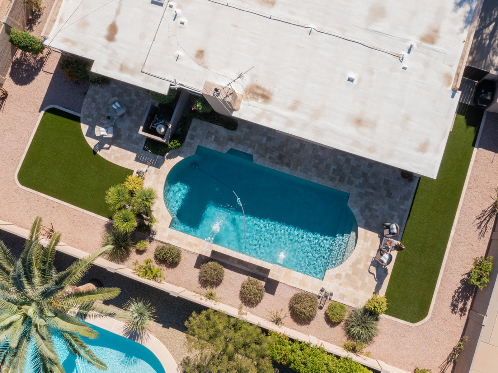 Aerial view of artificial turf and hardscaping installed in Buckeye, AZ