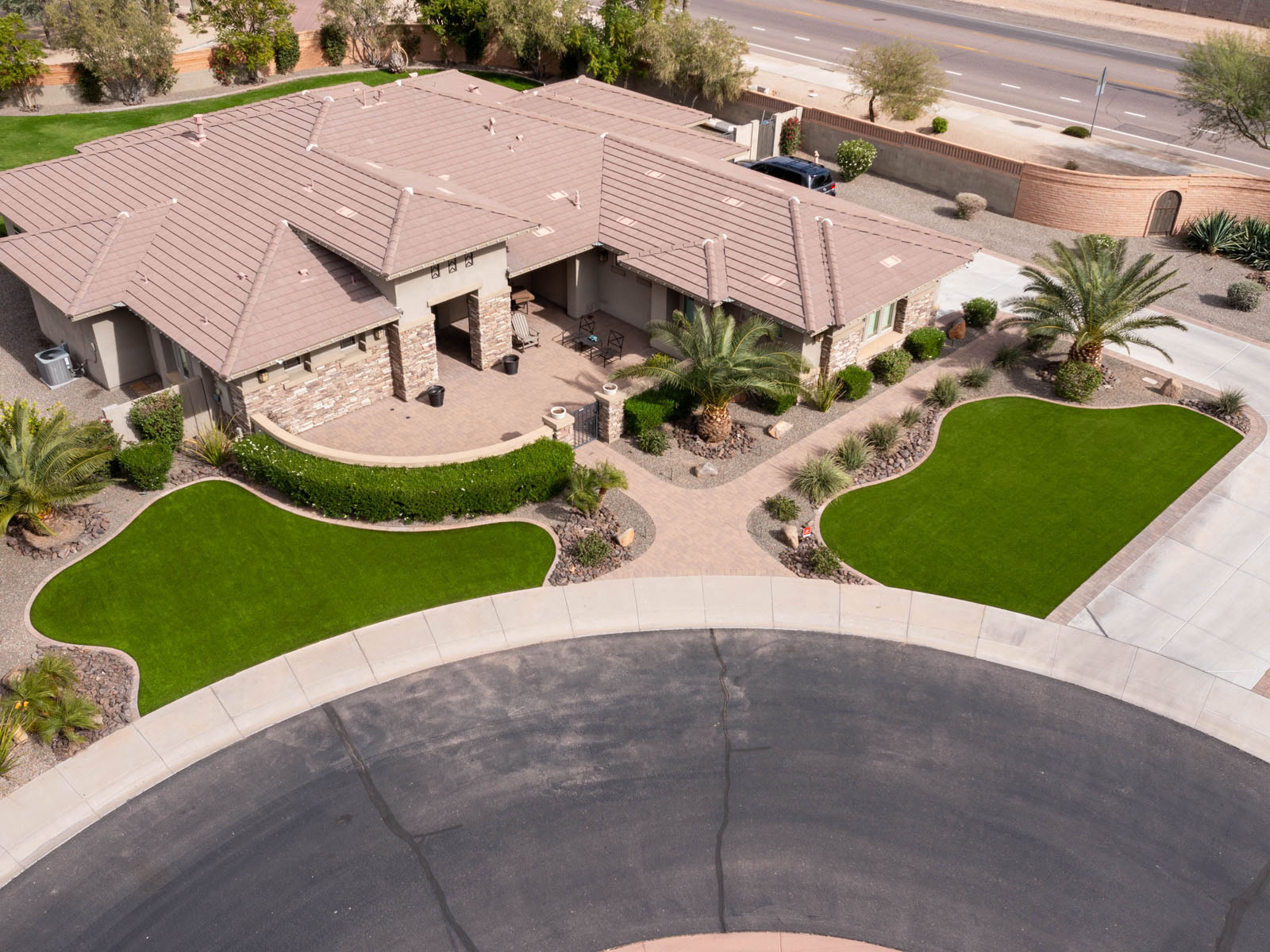 Aerial view of artificial turf and hardscaping installed in El Mirage, AZ