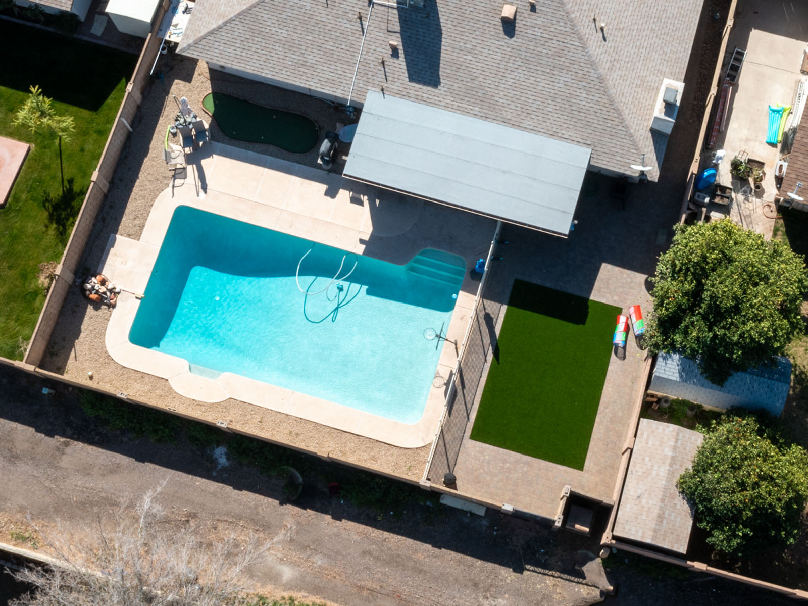 Aerial view of artificial turf and hardscaping installed in Tempe, AZ