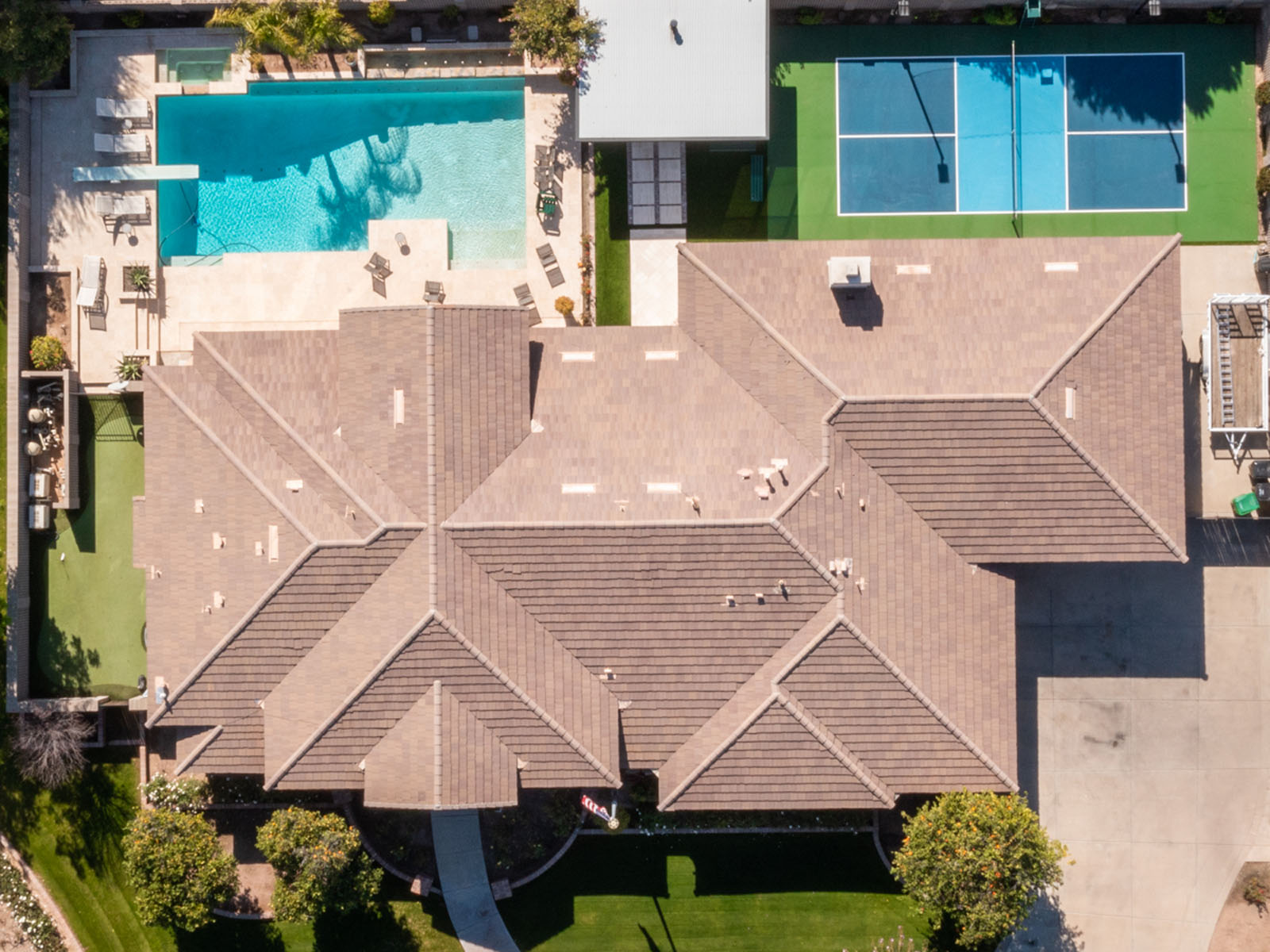 Aerial view of artificial turf and hardscaping installed in Sun City, AZ