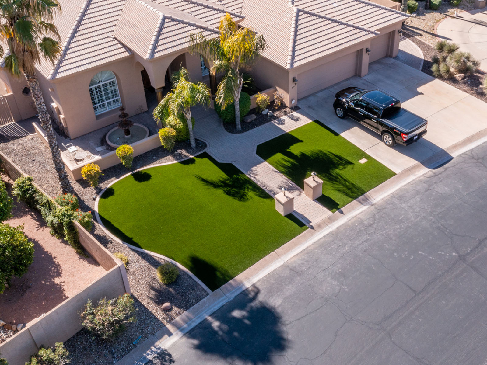 Aerial view of artificial turf and hardscaping installed in Peoria, AZ