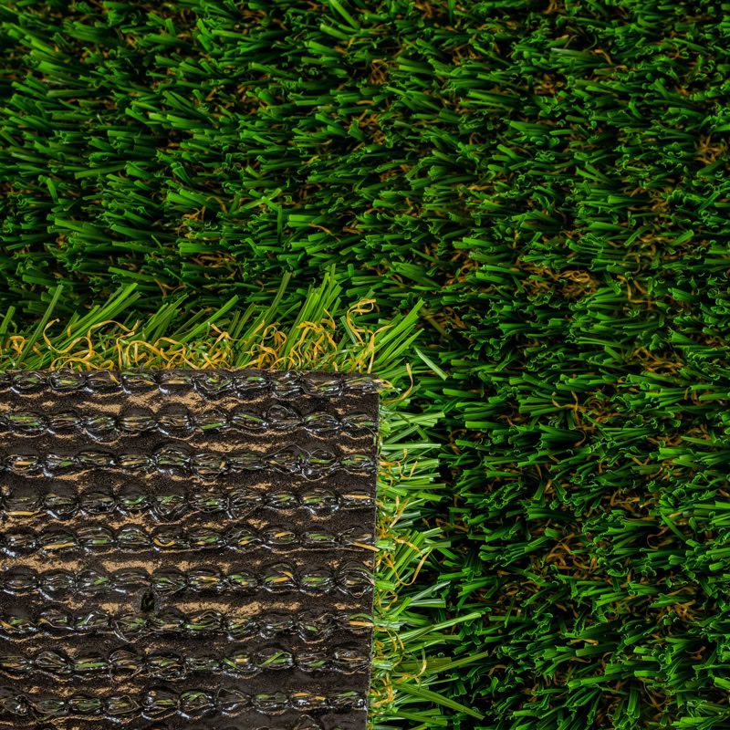 Close-up of lush green artificial turf for luxury lawns and putting greens.