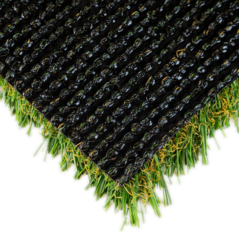 Close-up of black artificial turf with green grass backing.