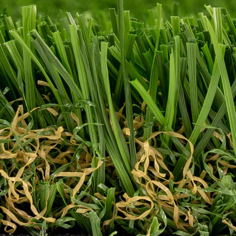 Close-up of lush green artificial turf with yellowish grass accents.