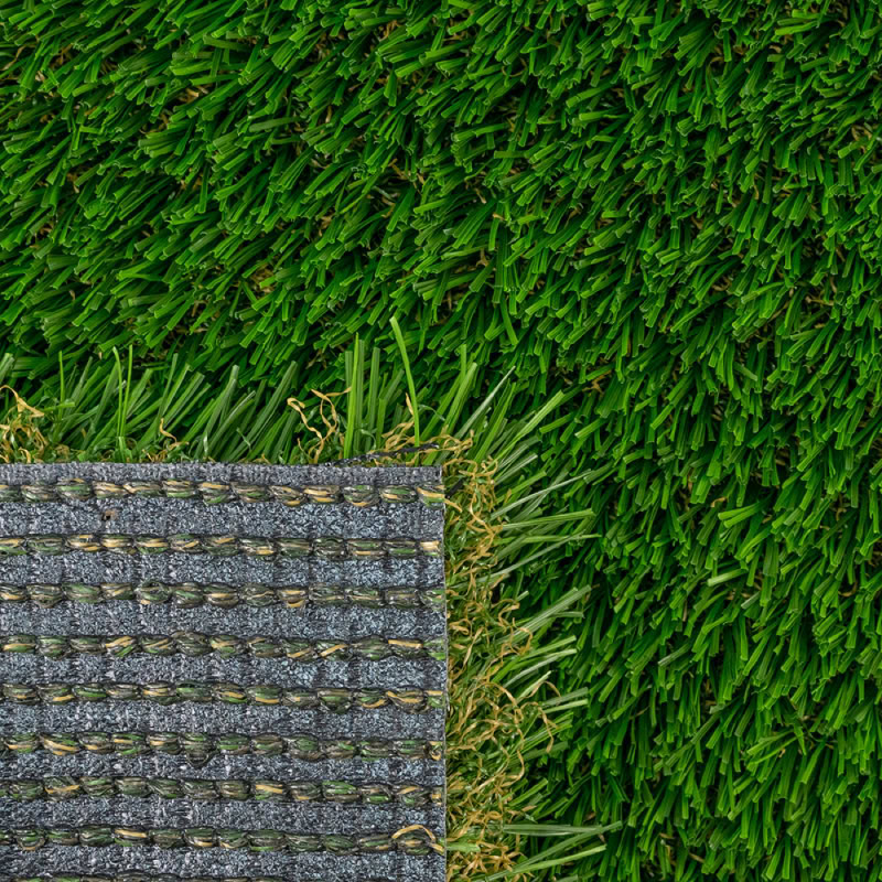 Close-up of lush green artificial turf and a textured putting green surface.