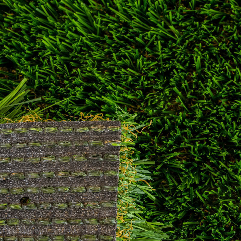 Close-up of lush green artificial turf for luxury lawns and putting greens.